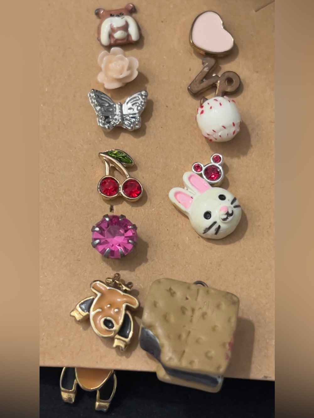 Kids collection of assorted decorative dozen earrings with various shapes.